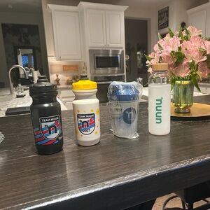 2 plastic water bottles, 1 glass with sleeve and a shaker bottle. All new Nuun